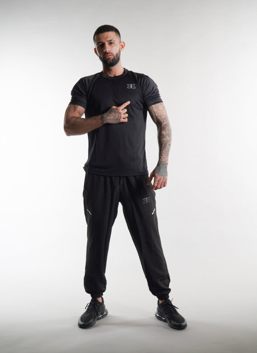 man wearing Elegante gym T-Shirt in black, activewear, mens gym clothing on white background