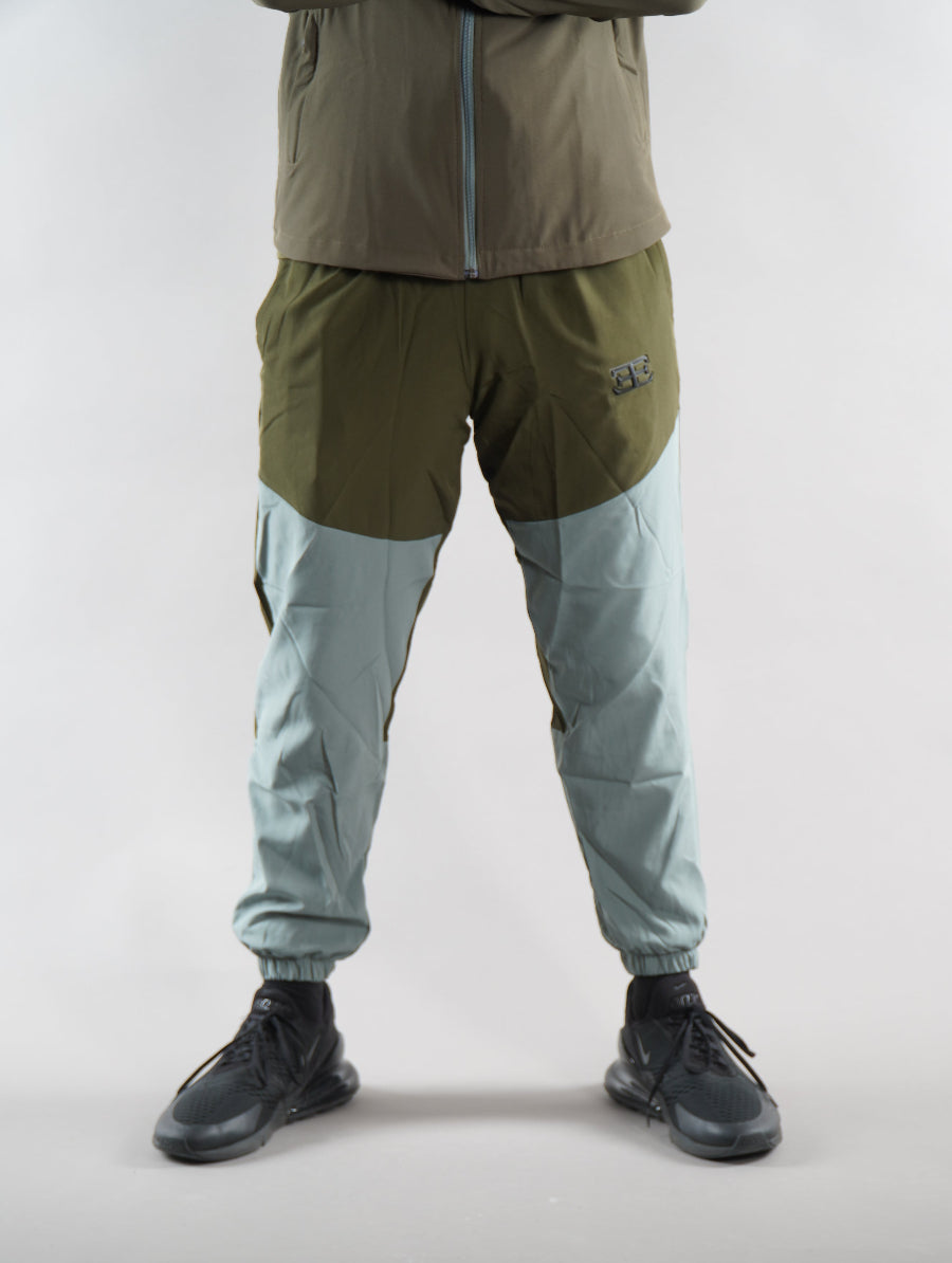man wearing olive green Tracksuit joggers, zoomed in, mens sports tracksuit sets, activewear, gym wear clothing
