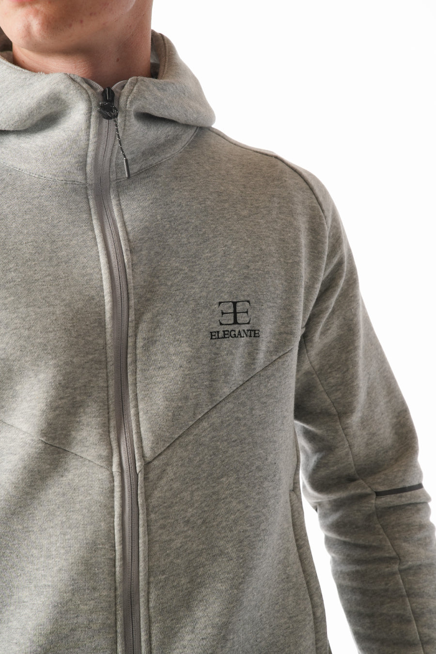 Man wearing Hazel Grey tracksuit on white background