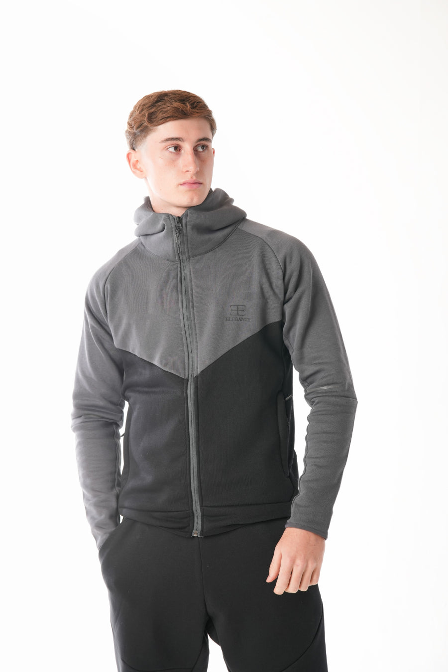 Man wearing Black steel grey Tracksuit on white background