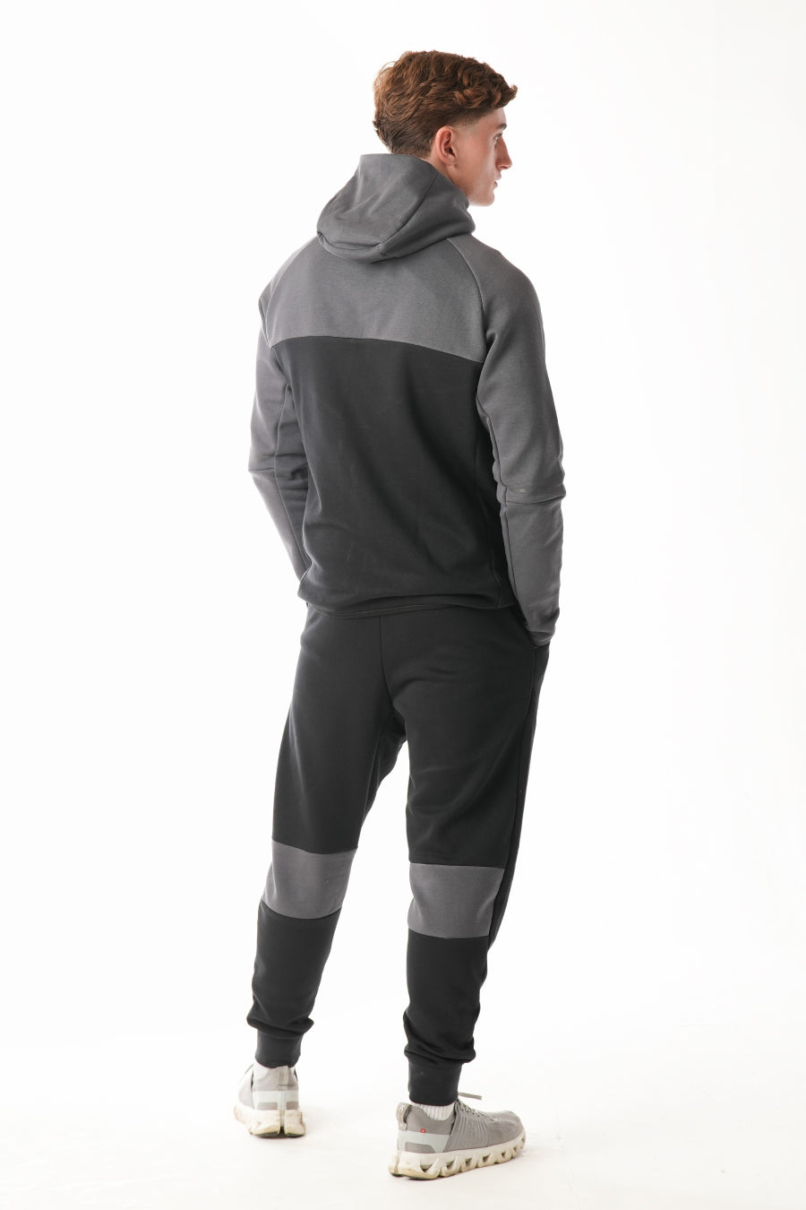 Man wearing Black steel grey Tracksuit on white background