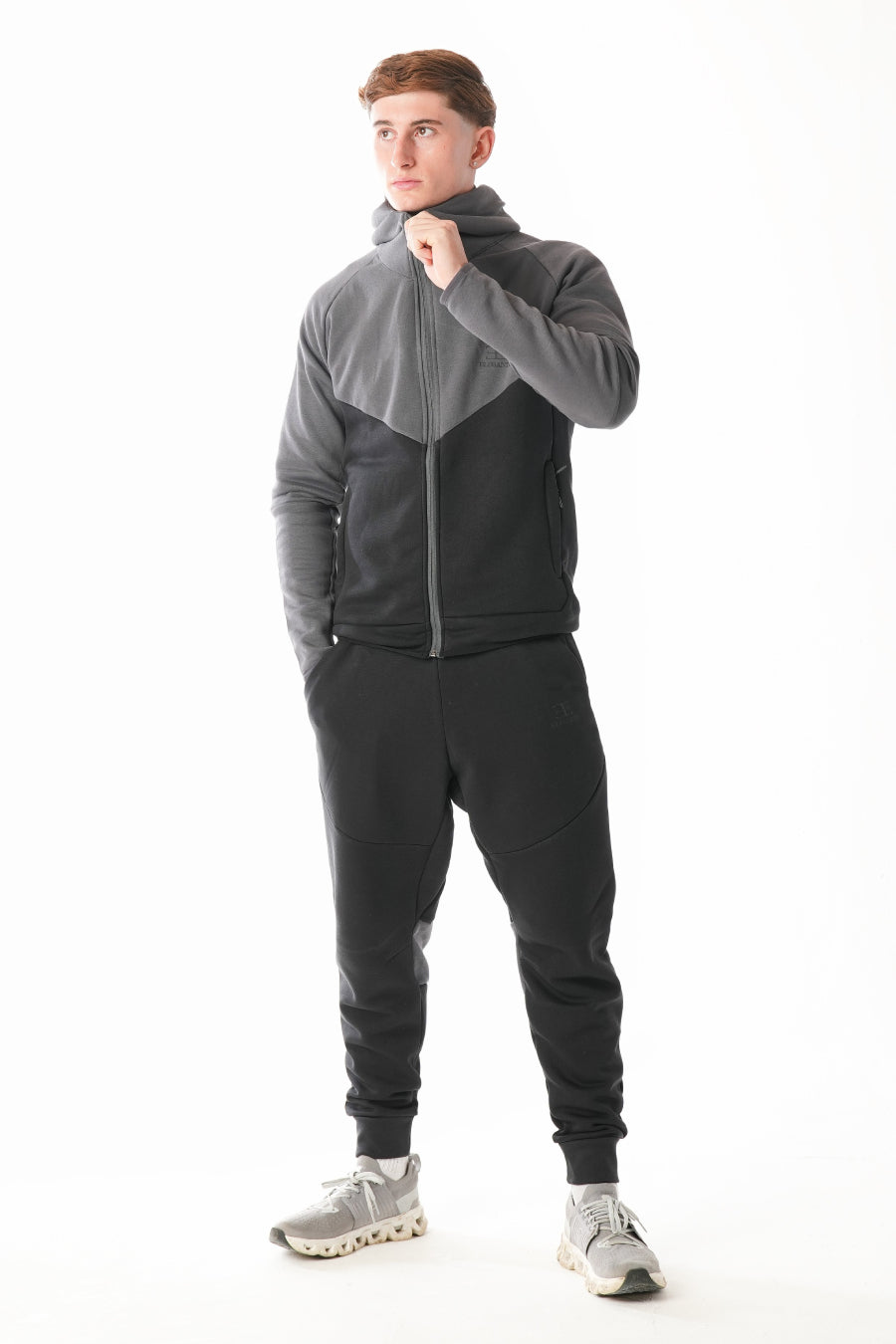 Man wearing Black steel grey Tracksuit on white background
