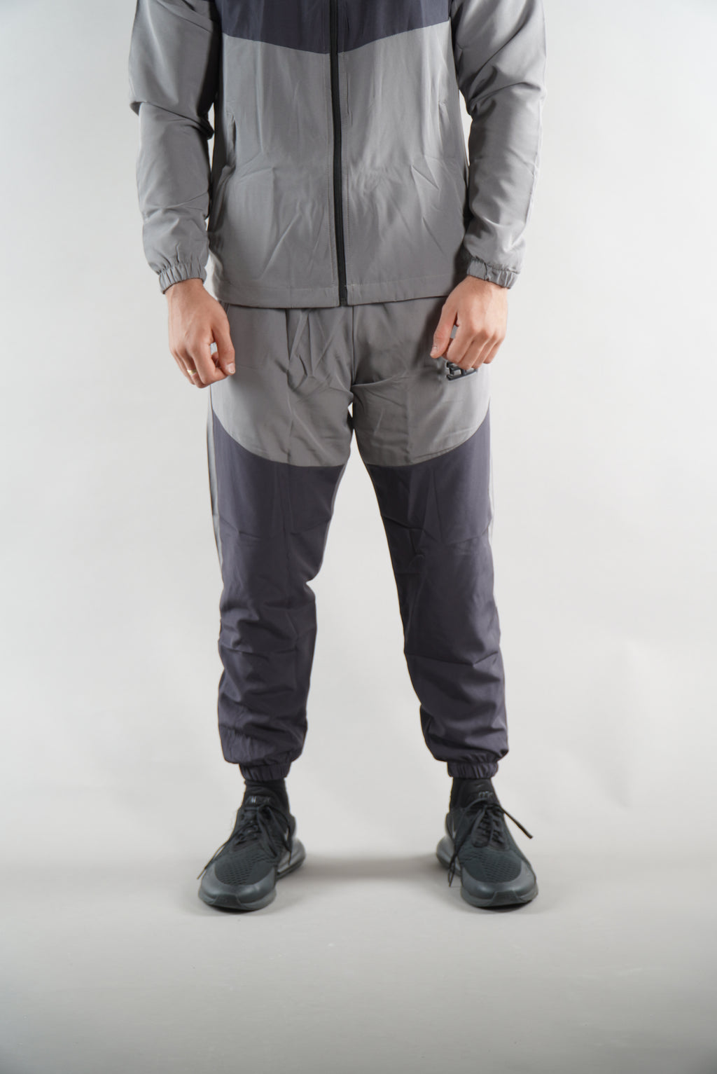 man wearing Grey Tracksuit joggers and tracksuit jacket with hood, activewear clothing
