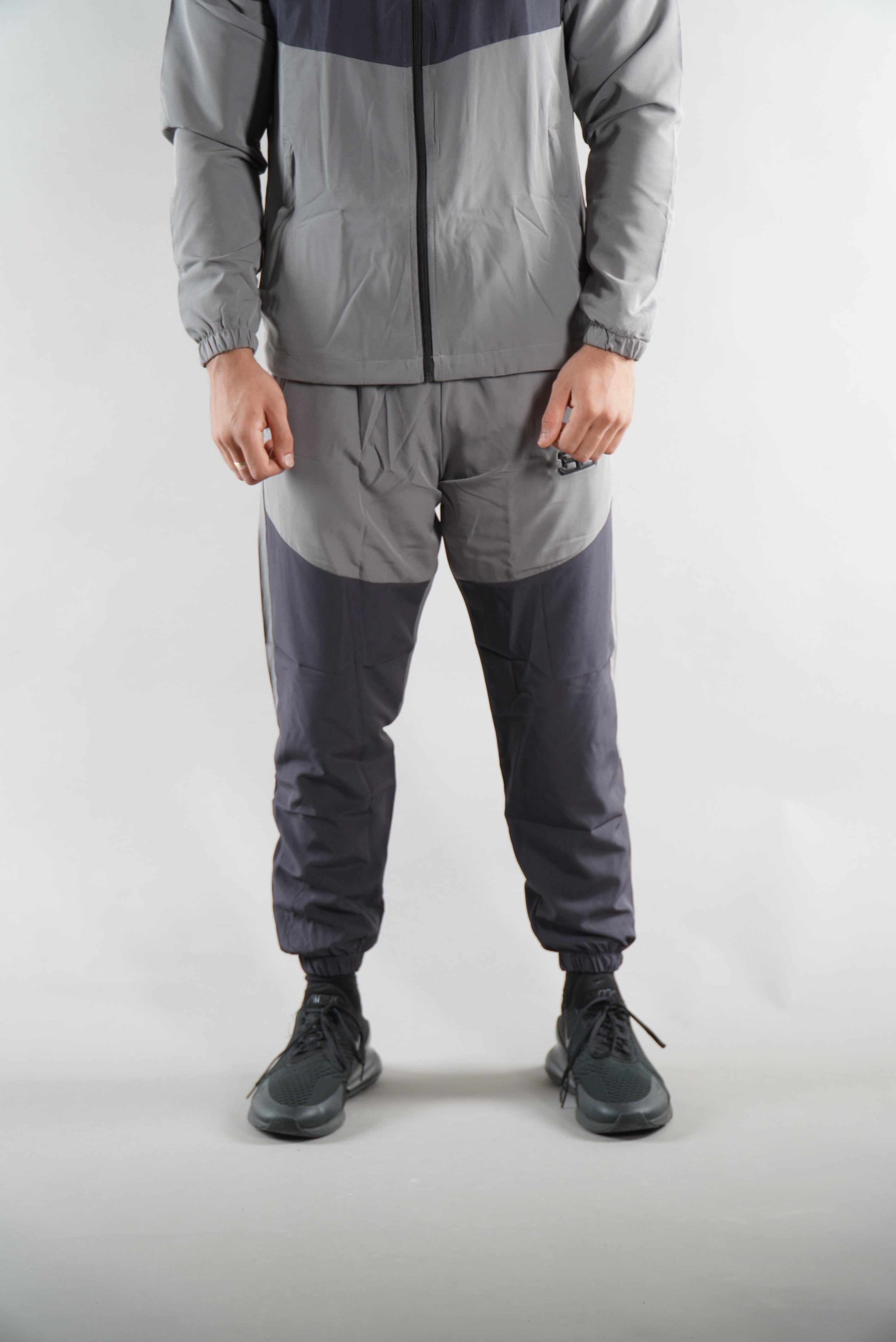 man wearing Grey Tracksuit joggers and tracksuit jacket with hood, activewear clothing